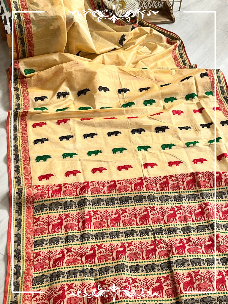 Kaziranga Assam Cotton Blend Saree in CREAM RED color with rhino motifs