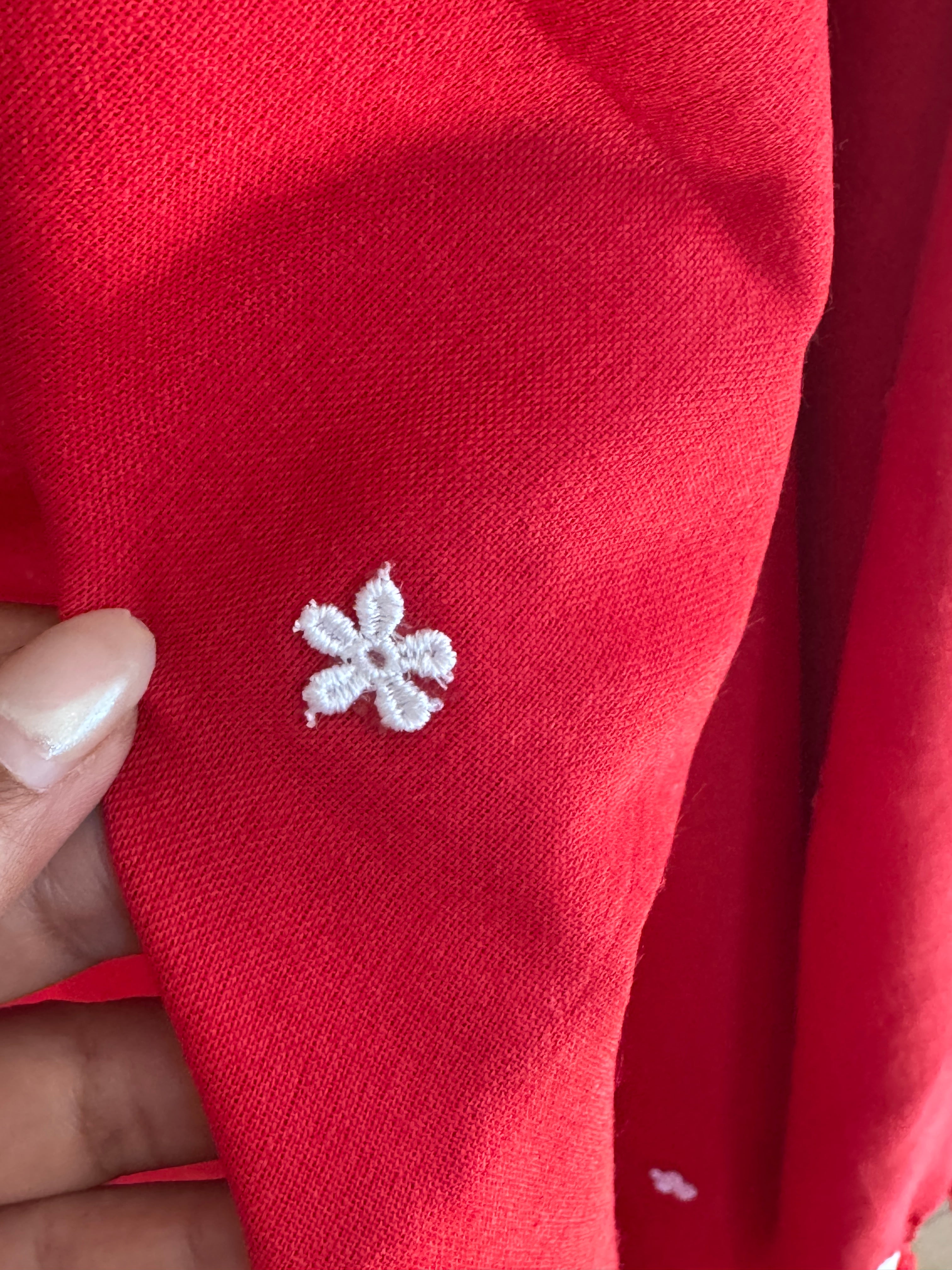 Red cotton saree with small white flowers