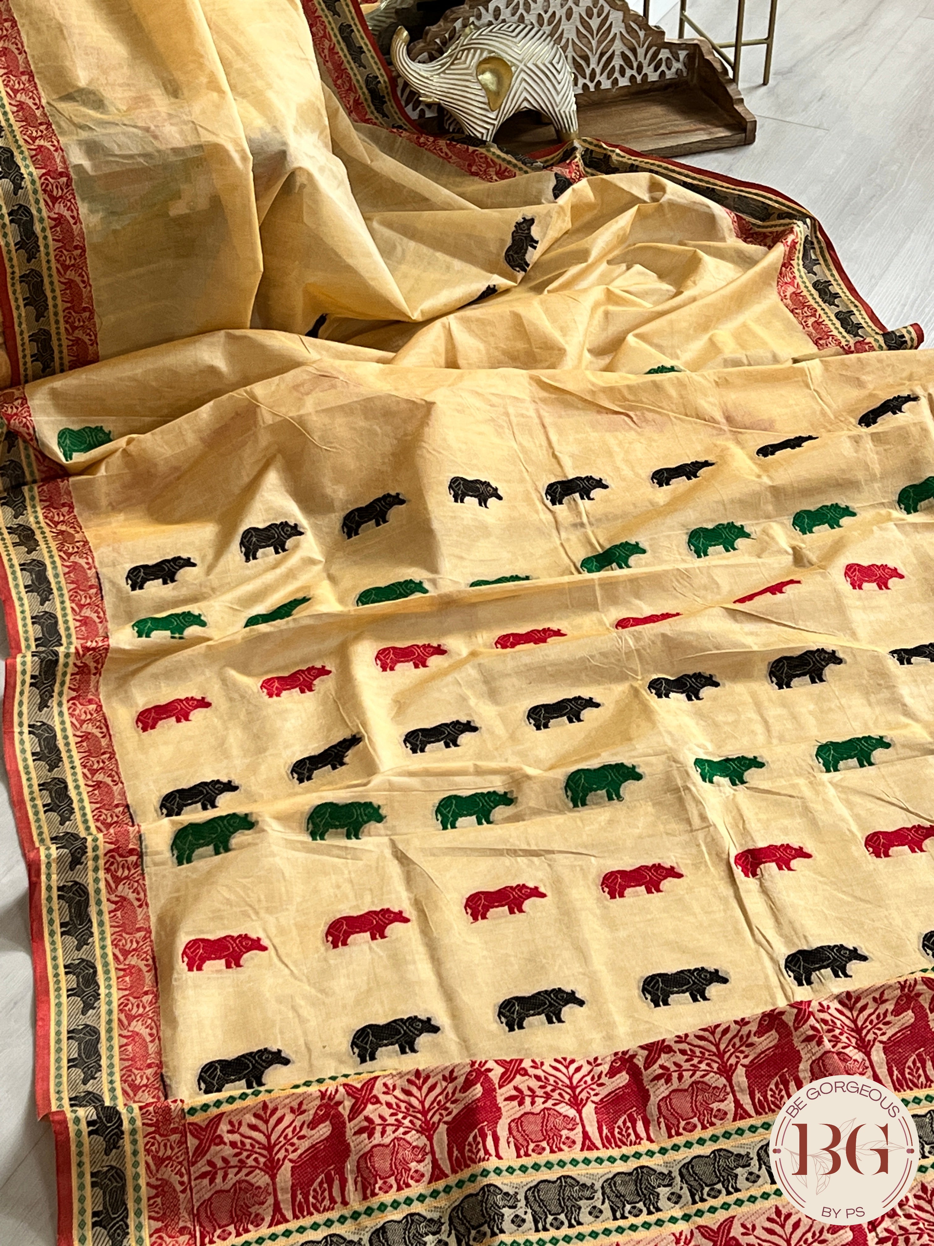 Kaziranga Assam Cotton Blend Saree in CREAM RED color with rhino motifs