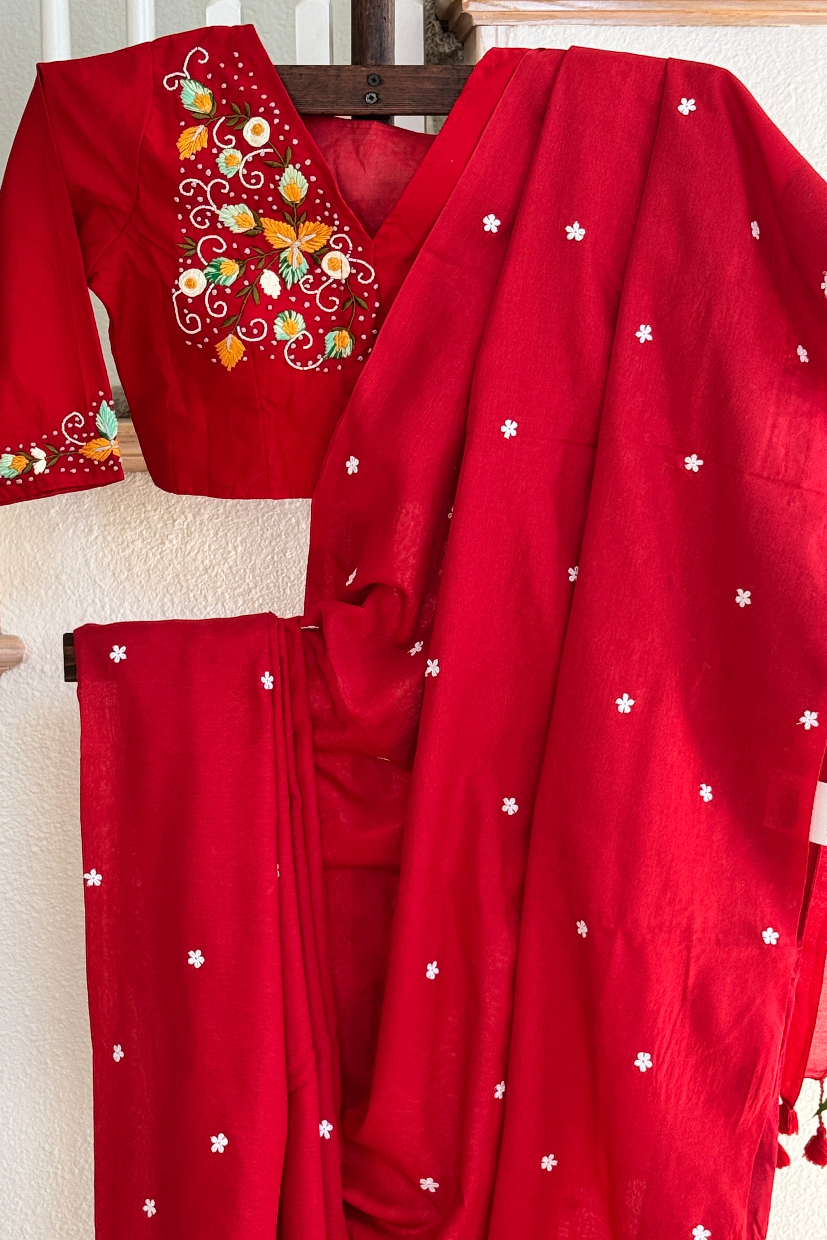 Red cotton saree with small white flowers