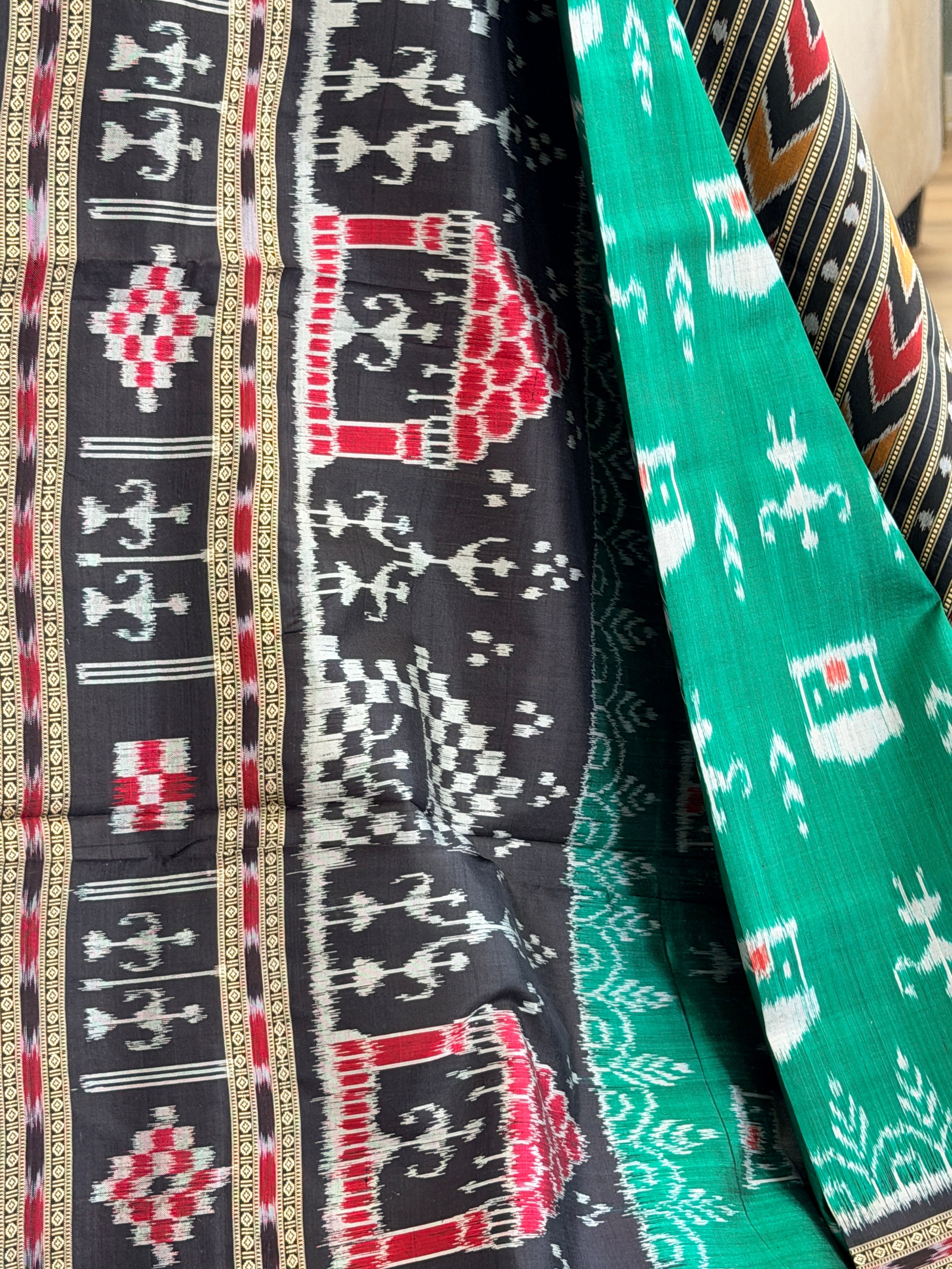 Green black tribal design khandua silk saree